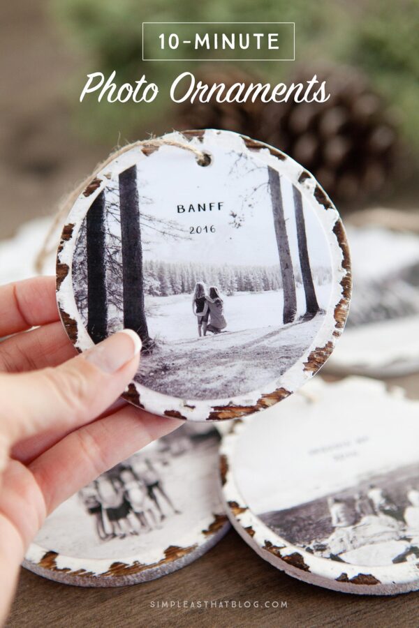 Hand holding photo ornament.