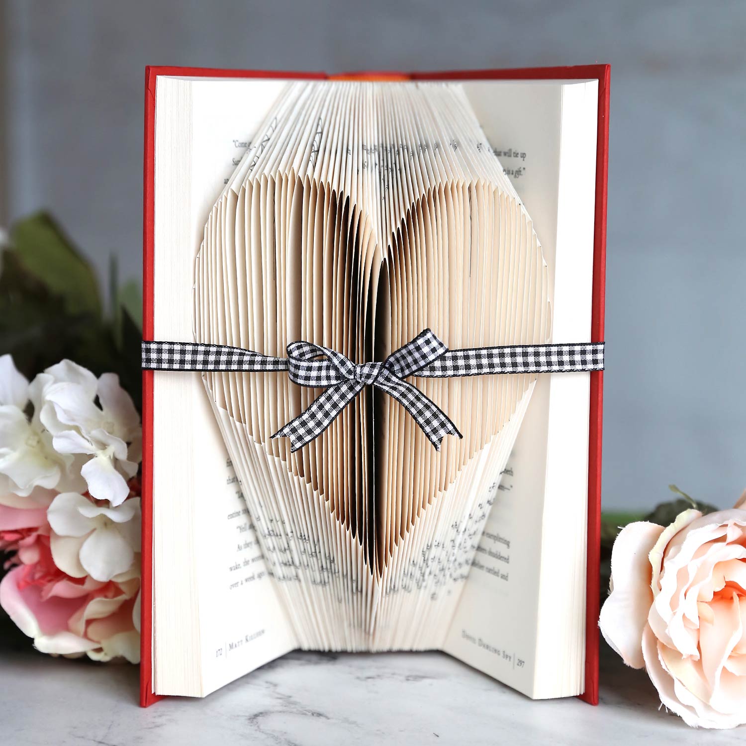 heart folded book tied with a ribbon