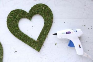 Moss glued onto front of wood heart.