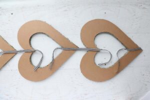 Two hearts attached with ribbon