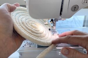 Lifting the left side of the base 45 degrees as you continue to sew.