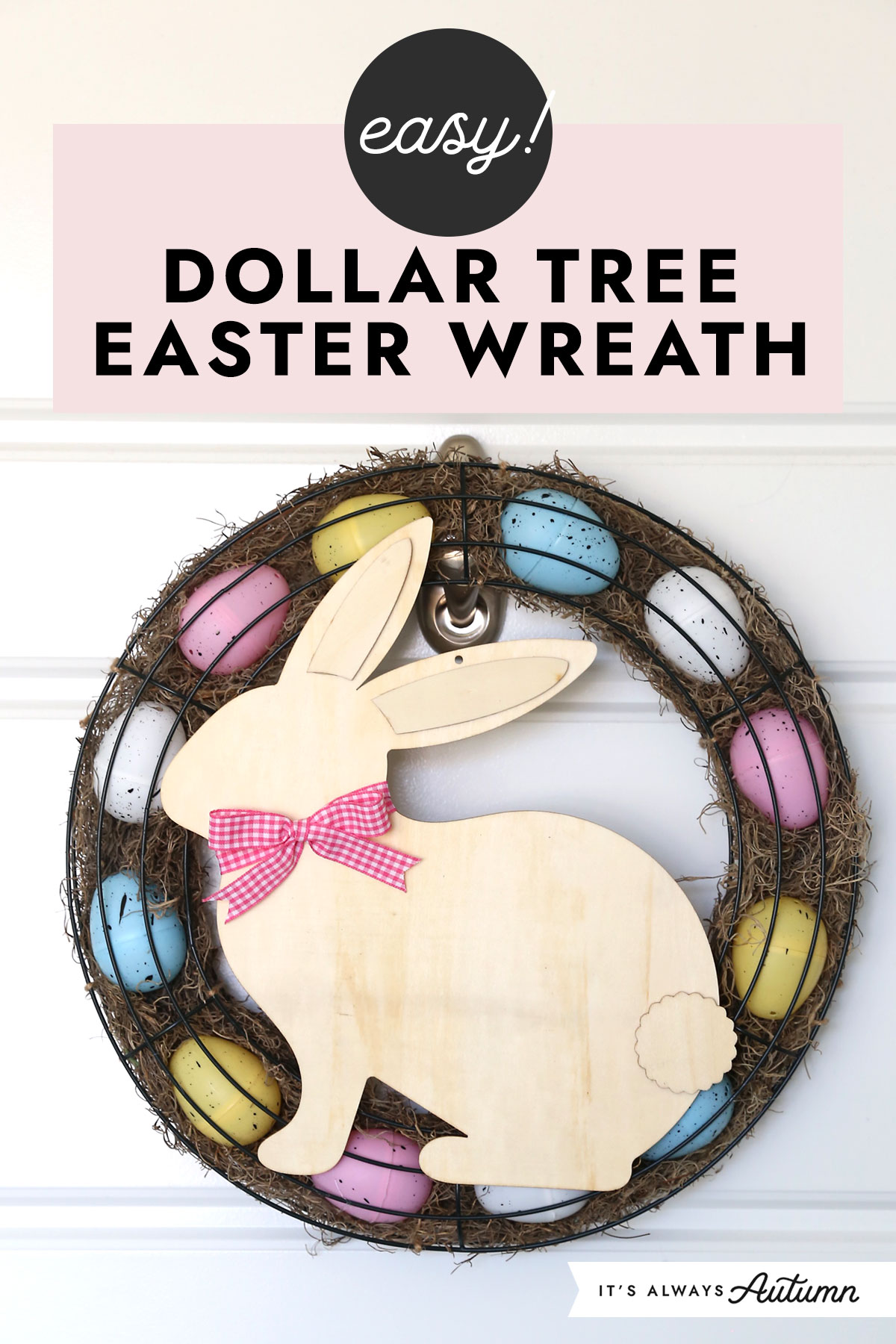 Easy! Dollar Tree Easter wreath made using two round wreath forms filled with moss and plastic Easter eggs, with a wood cutout bunny on top.