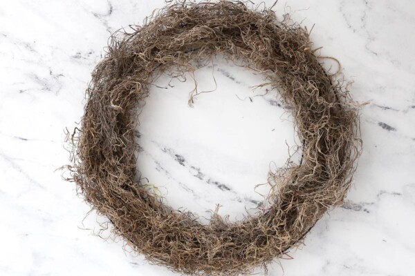 One circle wreath form covered in spanish moss.