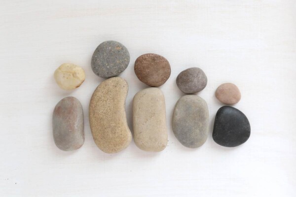 Pebbles arranged to look like family.