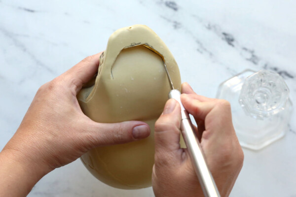 Cutting on the bottom of the plastic skull