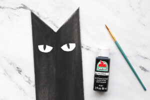 Small paintbrush to paint black pupils