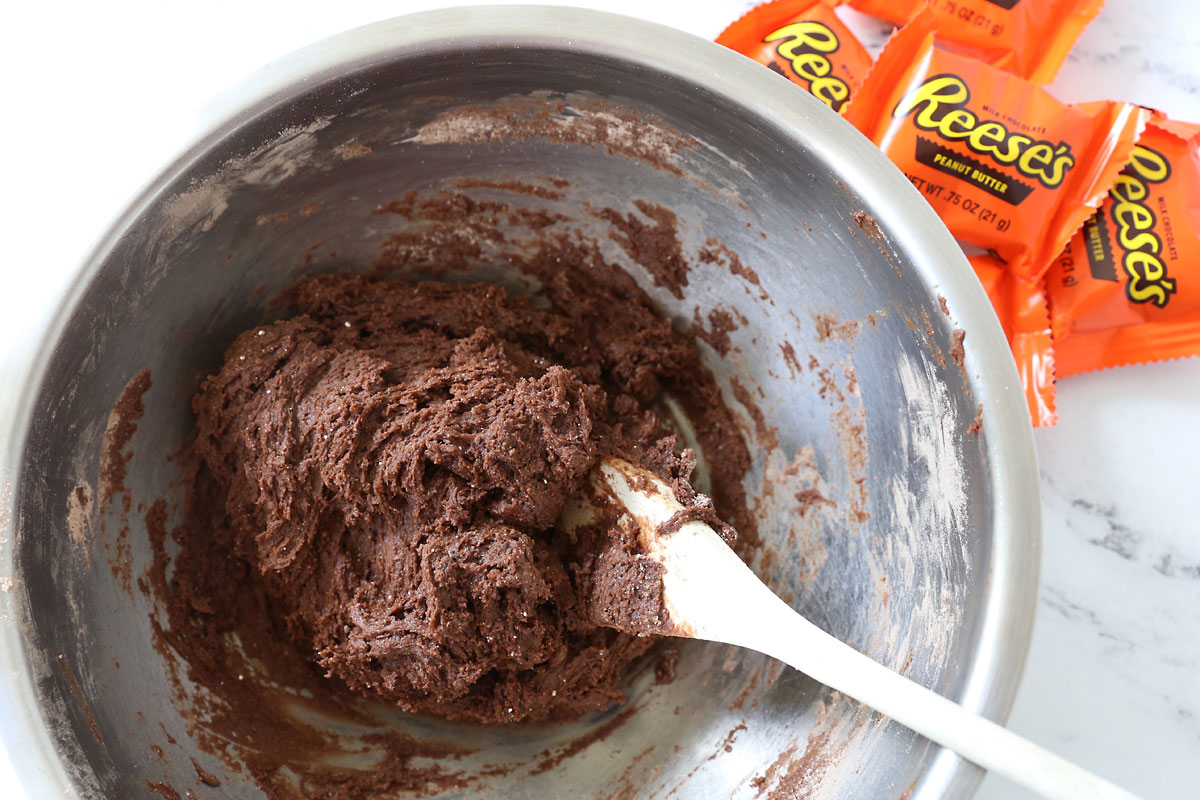 Chocolate cookie batter in a bowl.