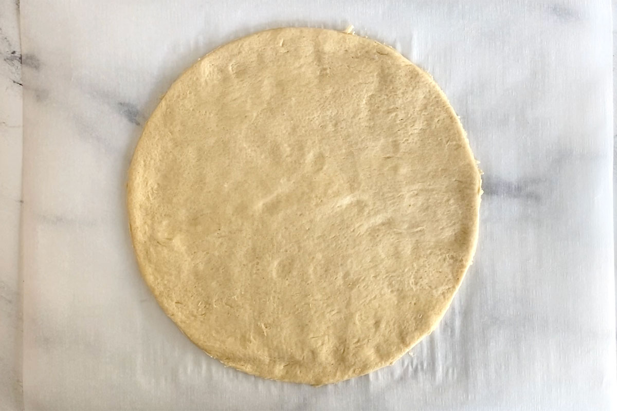 Crescent sheet cut into 9 inch circle.