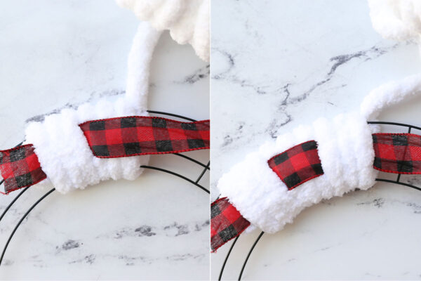 Wrapping yarn around wreath form, with ribbon over yarn for three wraps, then under yarn for three wraps.
