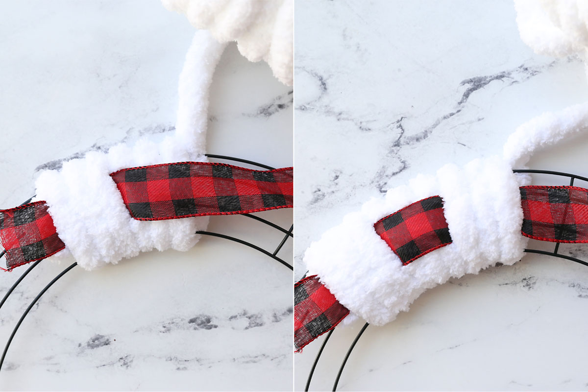 Wrapping yarn around wreath form, with ribbon over yarn for three wraps, then under yarn for three wraps.