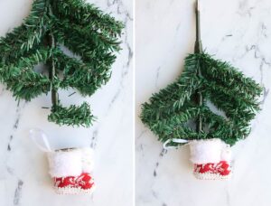 Top branches of Christmas tree bent and placed inside boot ornament.