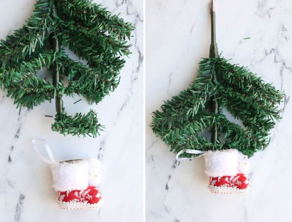 Top branches of Christmas tree bent and placed inside boot ornament.