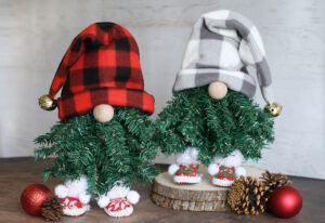 Two gnomes made from upside down Christmas trees.