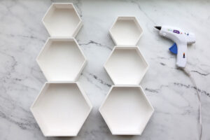 Hexagon shelves glued together to look like snowmen.
