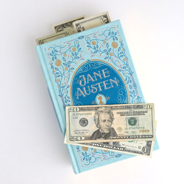 Large Jane Austen book with money in it.