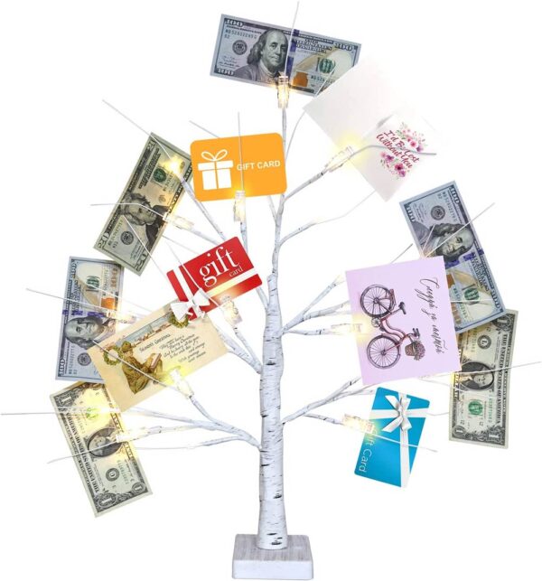 Small plastic tree holding money and gift cards.
