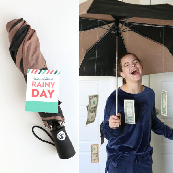 Umbrella with tag that says "save it for a rainy day"; girl holding open umbrella with dollar bills falling out