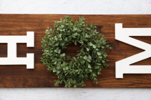Mini wreath glued on the sign.