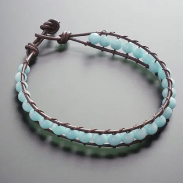 Leather wrap bracelet with blue beads.