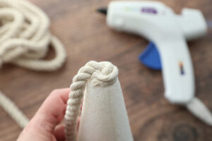 End of rope glued to bottom of foam cone.