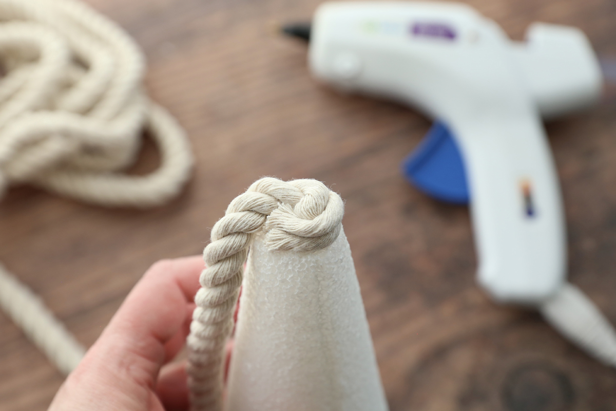 End of rope glued to bottom of foam cone.