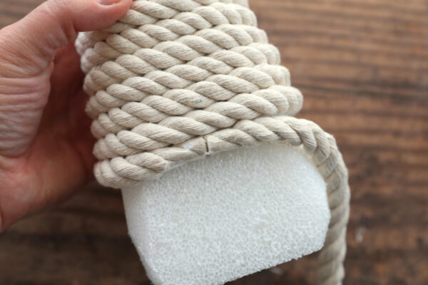 Gluing a second piece of rope on the foam cone.