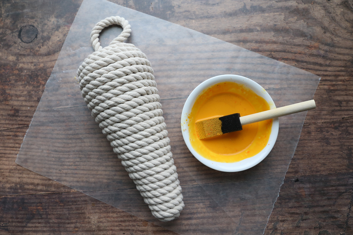 Rope covered cone and watered down orange paint.