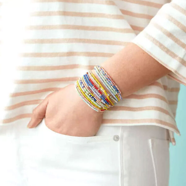 Stack of seed bead bracelets.