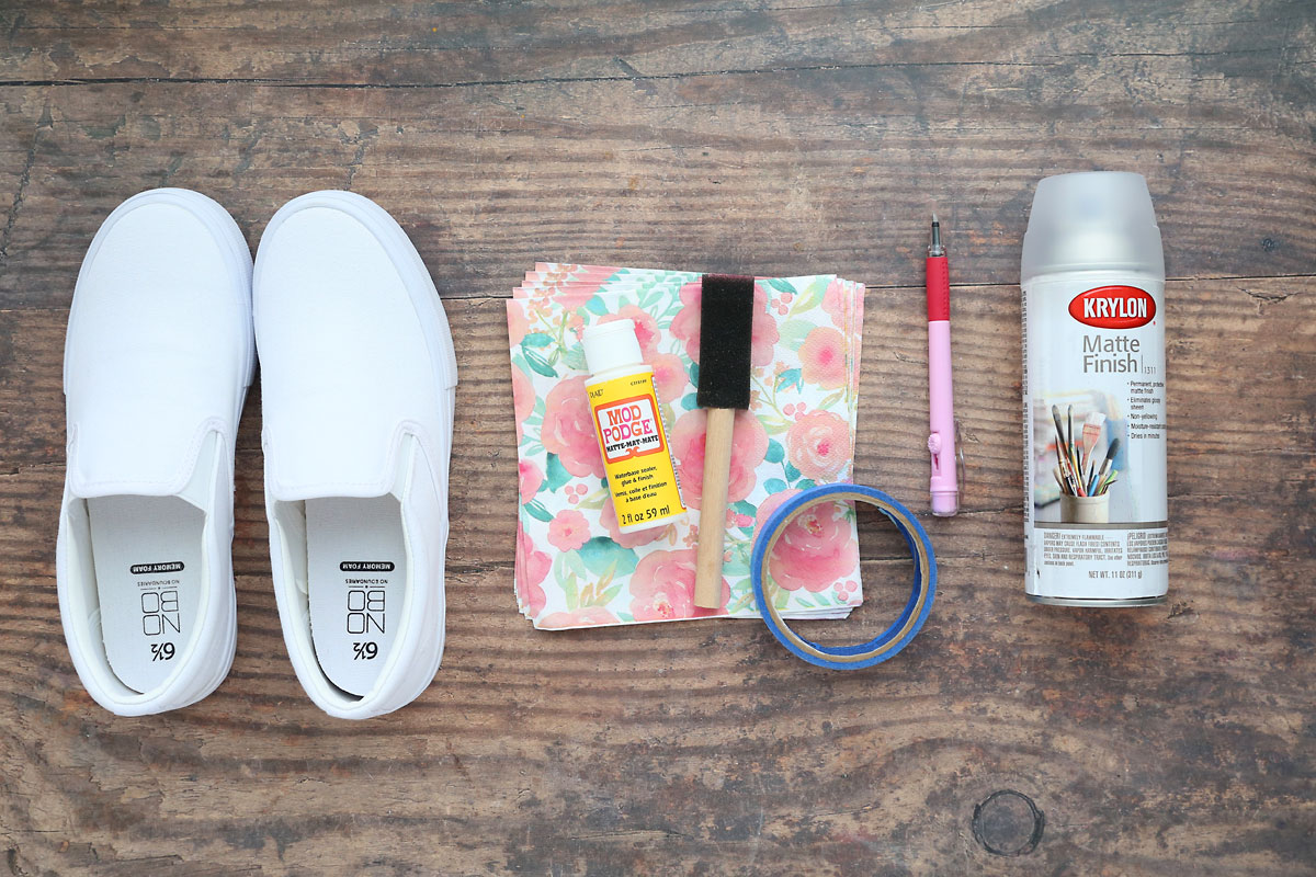 White canvas shoes, paper napkins, mod podge, paint brush, painters tape, exacto knife, clear sealant spray.