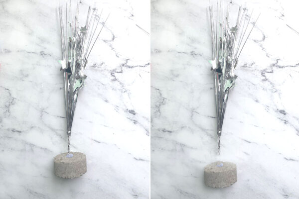 Sparkler portion of balloon weight separated from concrete base.