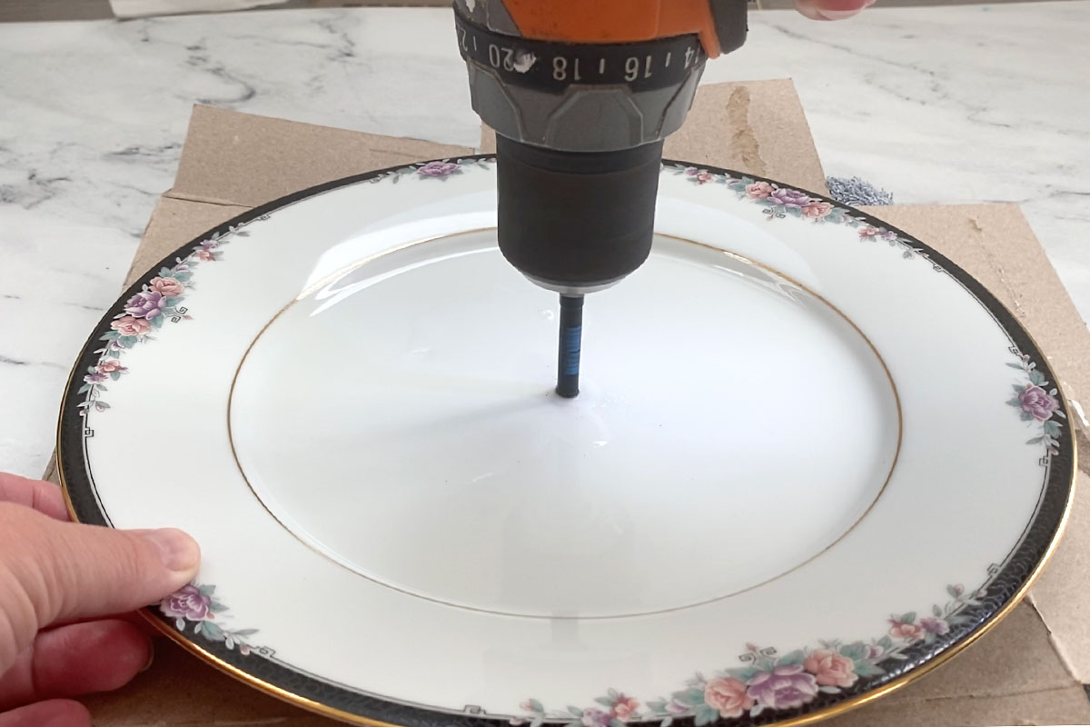 Drill perpendicular to the plate.