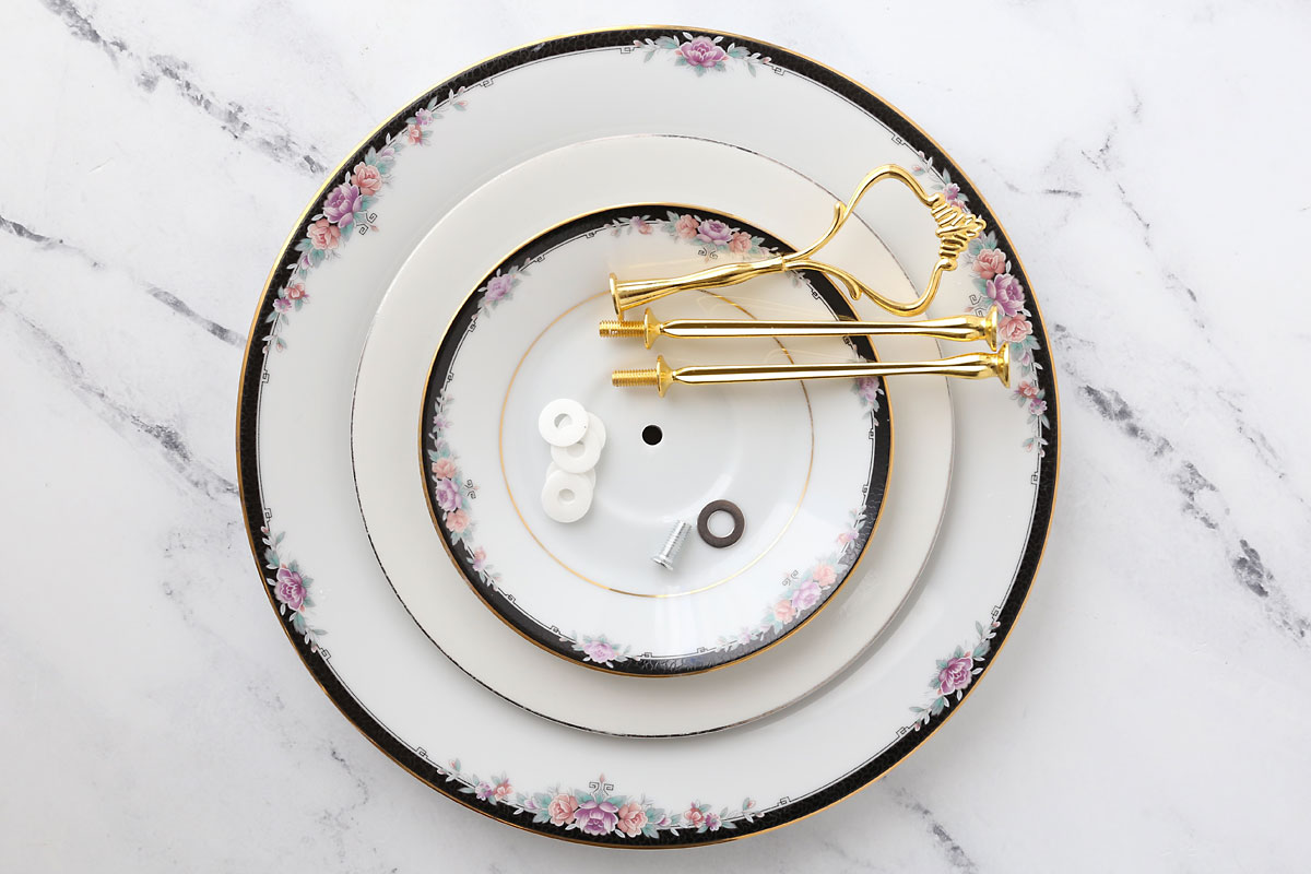 Three plates with holes drilled in the center; tiered tray hardware.