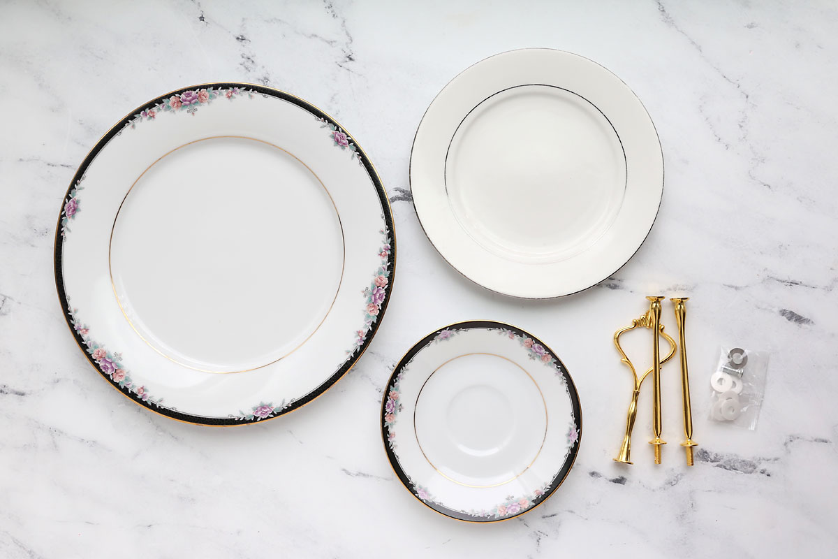 Three plates in various sizes; hardware for tiered tray.