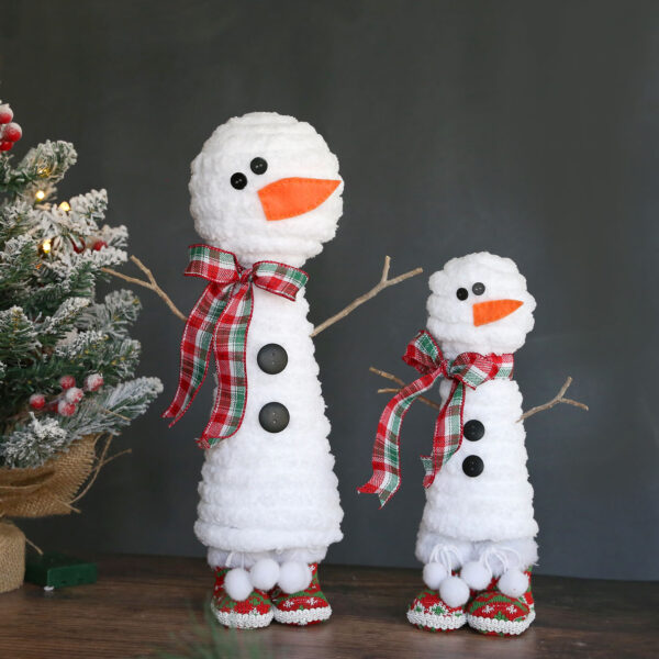Snowman craft made from a foam cone, a foam ball, and chunky yarn.