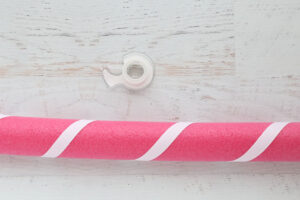 Wrapping the pool noddle with white ribbon.