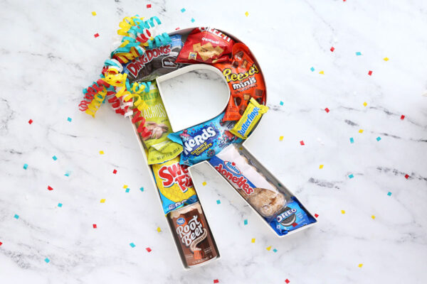 Cardboard letter filled with treats.