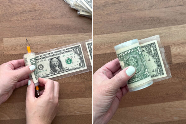 Rolling up the plastic sleeve.