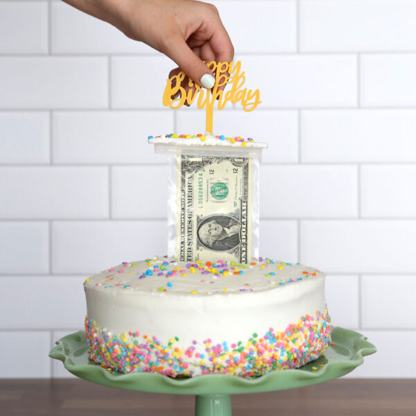 Pulling money out of a cake.