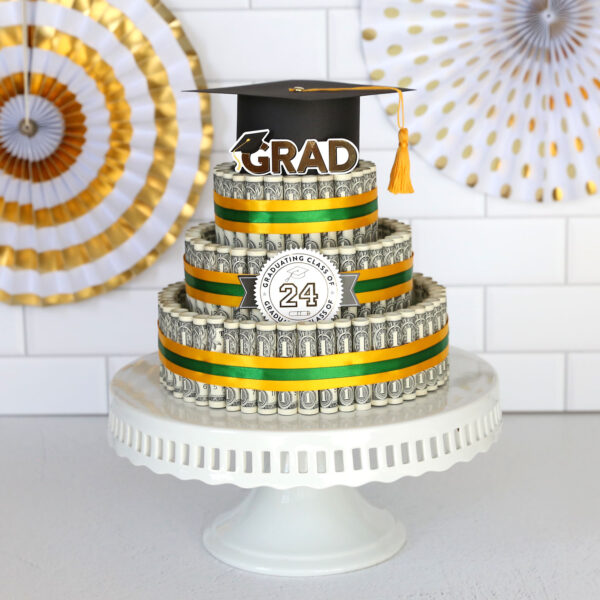 Three tiered cake made of money on a cake stand.