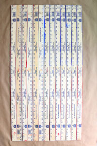 Yardsticks with painted side down.