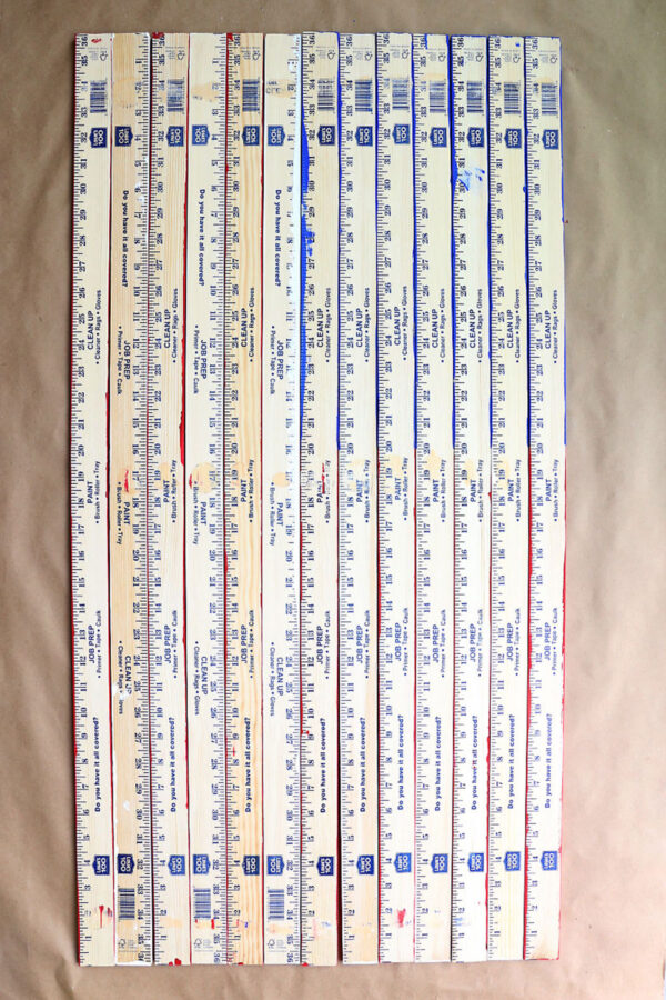 Yardsticks with painted side down.