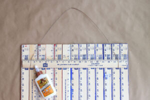 Half yardstick glued across the back of the other yardsticks.