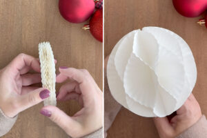 Opening up cupcake liners to create honeycomb sphere.
