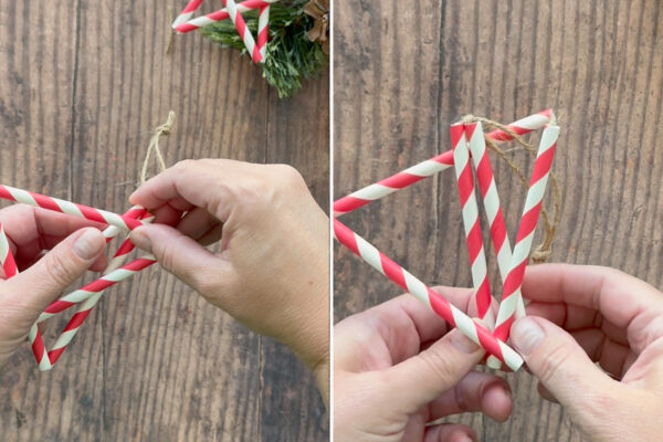 Tucking the top corner of the star under the horizontal straw to keep the star in place.