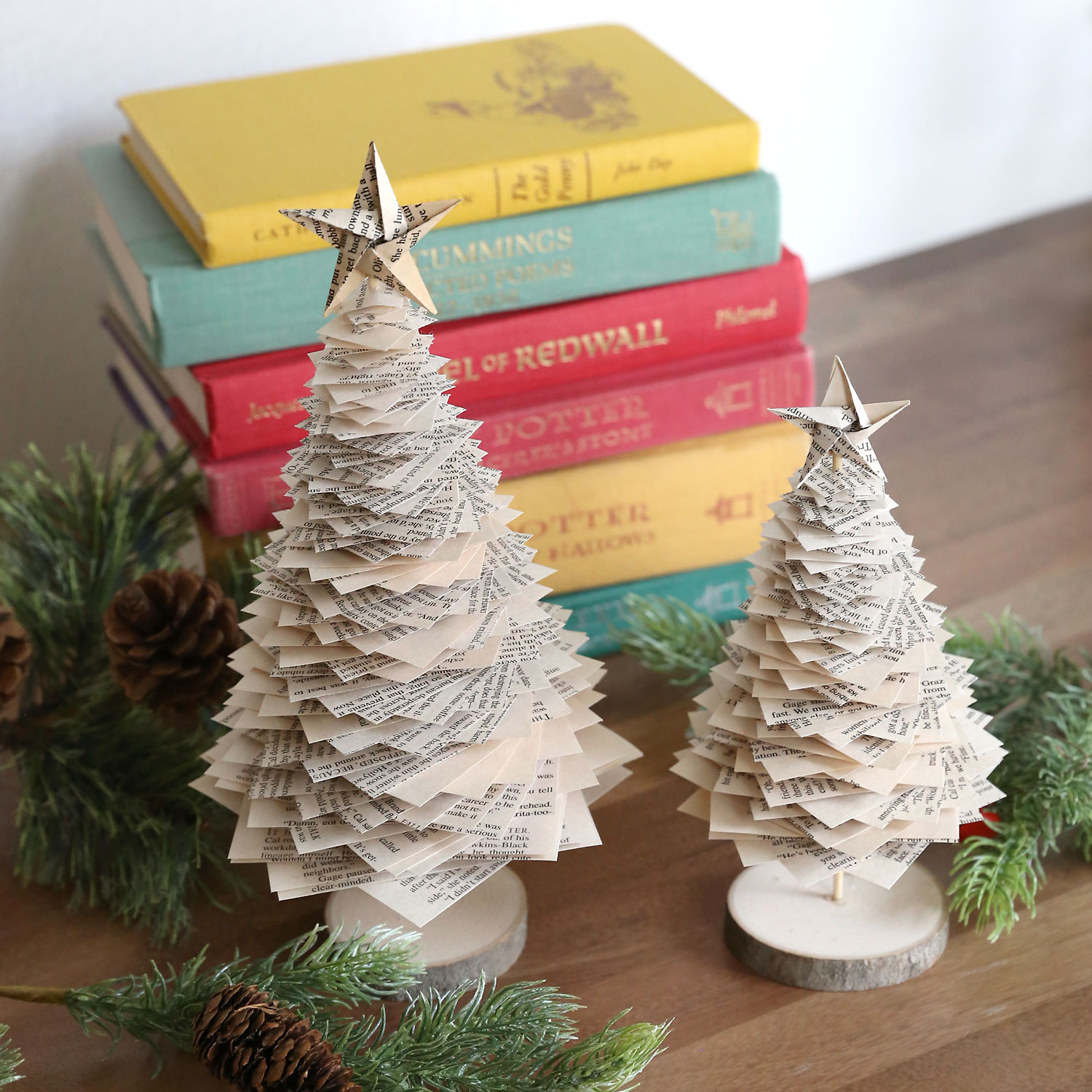 Large and small book page Christmas trees.