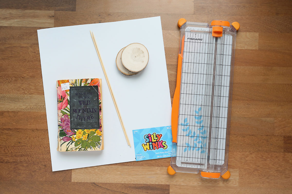 Craft foam, paperback book, bamboo skewer, wood round, paper trimmer.