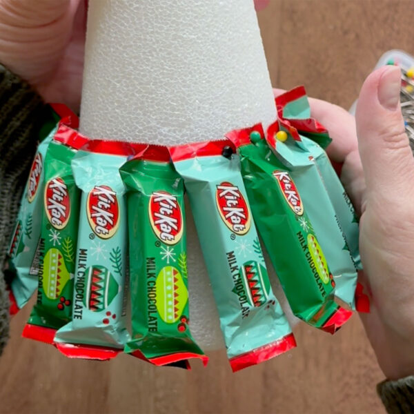 First row of candy attached to bottom of foam cone.