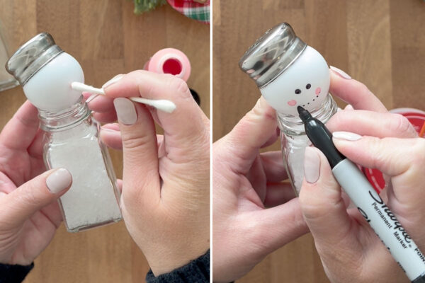 Using q-tip to dot pink cheeks; using sharpie to draw eyes and mouth.