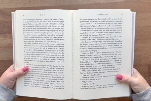 Opening up book and creasing binding.