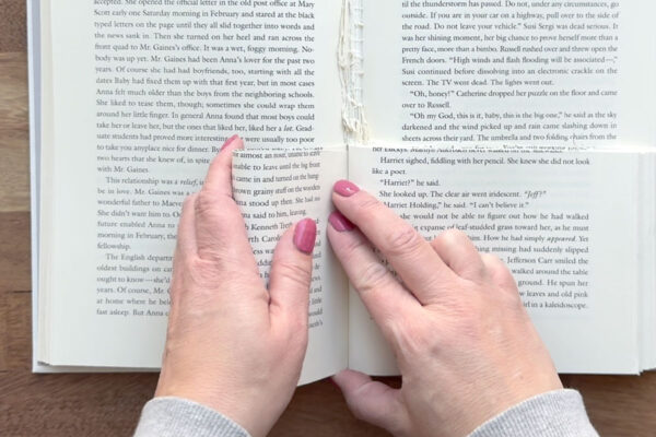 Rolling a section of pages and tucking it in near the spine.